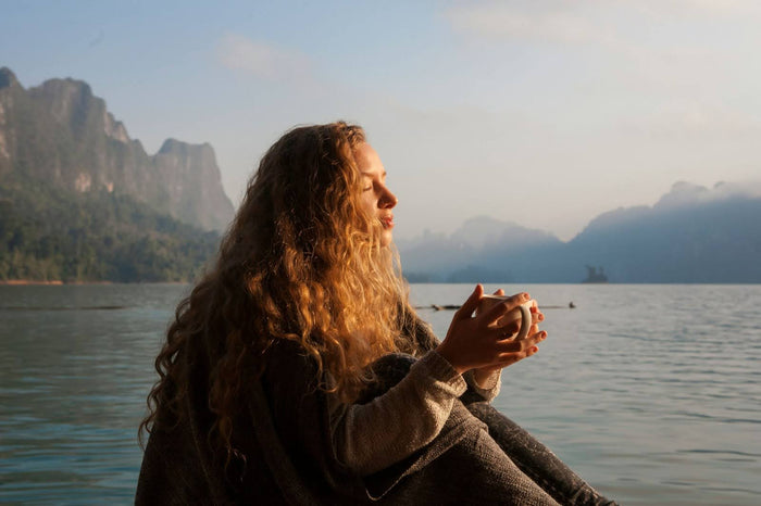 Woman Sitting Outside In Nature
