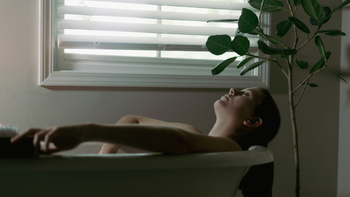 Woman Resting In A Bathtub After CBG And CBD Use