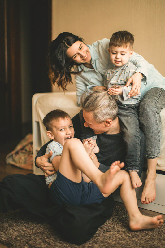 Parents Playing with kids. Managing stress during the Holidays 